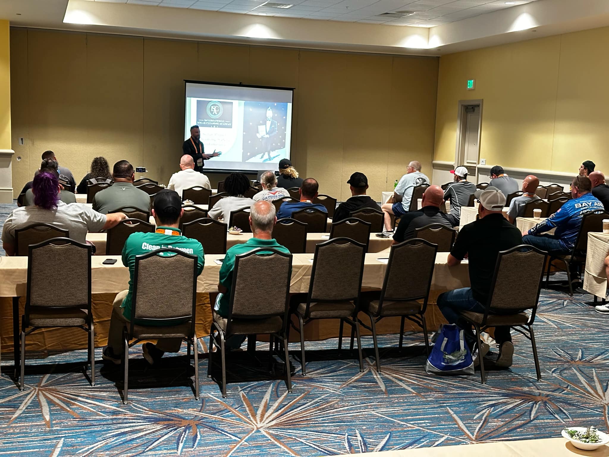 Studaents in a classroom being taught by an instructor